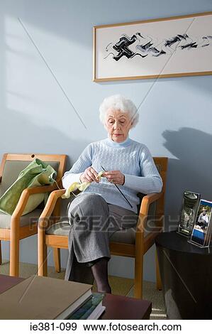 Stock Photo - A senior woman waiting in a doctors office. Fotosearch
