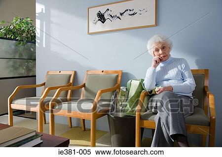 A senior woman waiting in a doctors office View Large Photo Image Stock Photography - A senior woman waiting in a doctors office. Fotosearch