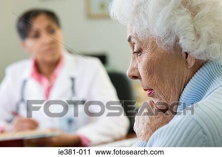A worried woman at the doctors View Large Photo Image Stock Image - A worried woman at the doctors. Fotosearch