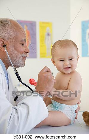 Doctor examining a baby View Large Photo Image Stock Image - Doctor examining a baby. Fotosearch