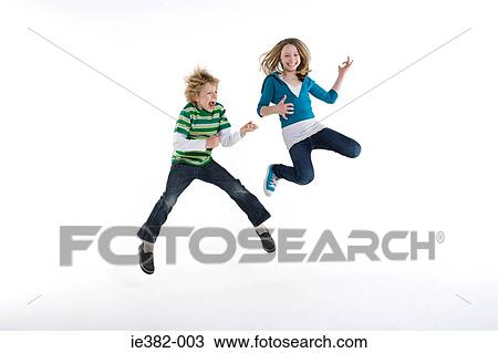 A boy and girl jumping View Large Photo Image Stock Image - A boy and girl jumping. Fotosearch