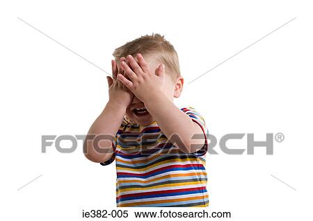 A boy covering his eyes View Large Photo Image Stock Photography - A boy covering his eyes. Fotosearch