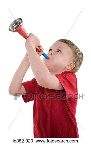 A boy playing a trumpet View Large Photo Image Stock Image - A boy playing a trumpet. Fotosearch