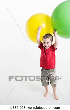 A boy playing with balloons View Large Photo Image Stock Photo - A boy playing with balloons. Fotosearch