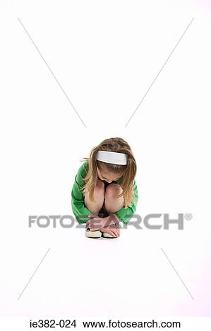 A girl crouching View Large Photo Image Picture - A girl crouching. Fotosearch
