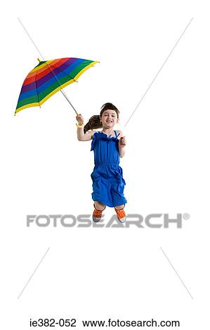 A girl jumping with an umbrella View Large Photo Image Stock Image - A girl jumping with an umbrella. Fotosearch