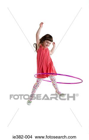 A girl playing with a plastic hoop View Large Photo Image Picture - A girl playing with a plastic hoop. Fotosearch