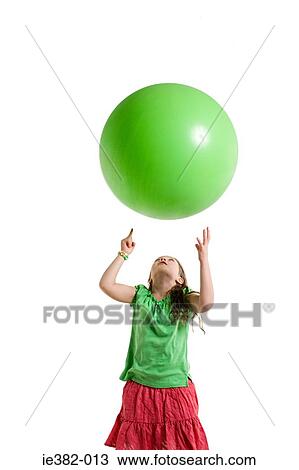 A girl throwing a ball View Large Photo Image Stock Image - A girl throwing a ball. Fotosearch