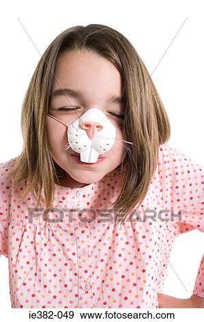 A girl wearing a mask View Large Photo Image Stock Photo - A girl wearing a mask. Fotosearch