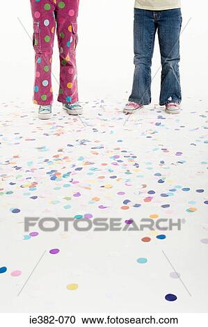 The legs of two girls and confetti View Large Photo Image Stock Image - The legs of two girls and confetti. Fotosearch