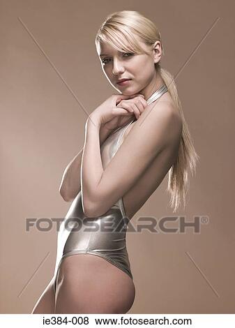 Young woman in silver outfit View Large Photo Image Stock Photo - Young woman in silver outfit. Fotosearch