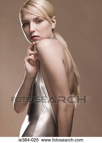 Young woman in silver outfit View Large Photo Image Stock Photography - Young woman in silver outfit. Fotosearch