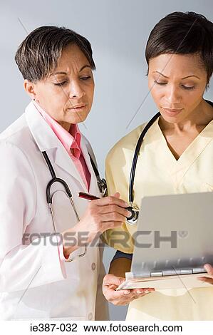 A doctor and nurse View Large Photo Image Stock Image - A doctor and nurse. Fotosearch