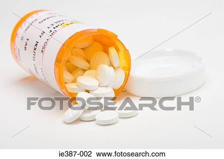 Tablets spilling out of a bottle View Large Photo Image Stock Image - Tablets spilling out of a bottle. Fotosearch