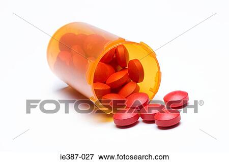 Tablets spilling out of a bottle View Large Photo Image Stock Photo - Tablets spilling out of a bottle. Fotosearch