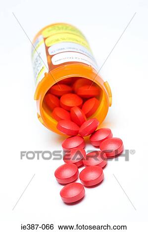 Tablets spilling out of a bottle View Large Photo Image Stock Photograph - Tablets spilling out of a bottle. Fotosearch
