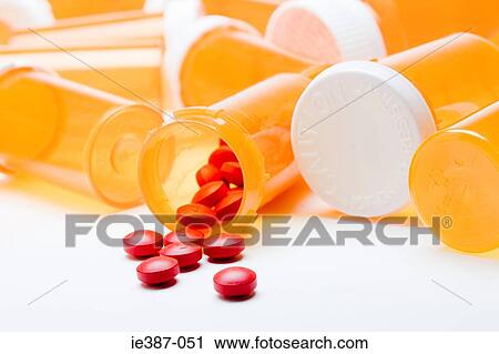 Tablets spilling out of a container View Large Photo Image Stock Image - Tablets spilling out of a container. Fotosearch