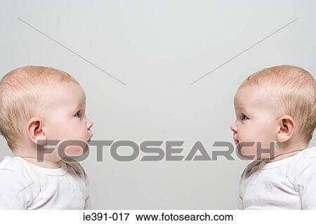 Babies face to face View Large Photo Image Stock Photo - Babies face to face. Fotosearch
