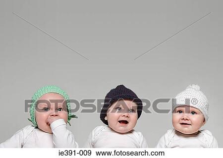 Babies in hats View Large Photo Image Stock Photo - Babies in hats. Fotosearch