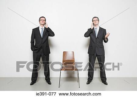 Businessman with cellphones View Large Photo Image Stock Photo - Businessman with cellphones. Fotosearch