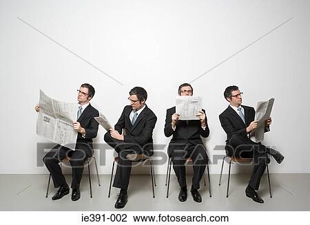 Businessmen reading newspaper View Large Photo Image Stock Image - Businessmen reading newspaper. Fotosearch