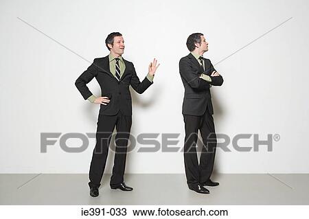 Man ignoring man View Large Photo Image Stock Image - Man ignoring man. Fotosearch