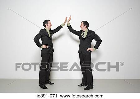 Men doing high five View Large Photo Image Stock Image - Men doing high five. Fotosearch
