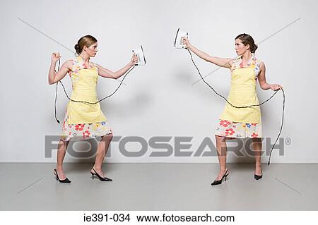 Picture - Women with irons. Fotosearch
