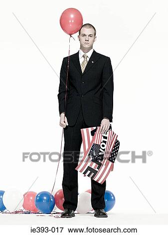 Stock Photo - Man with balloons and signs. Fotosearch