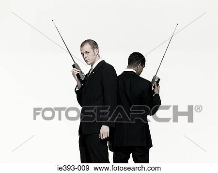 Stock Photo - Men with walkie talkies. Fotosearch