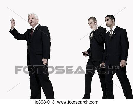 Stock Image - Politician and bodyguards. Fotosearch