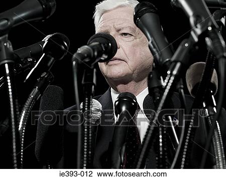 Stock Image - Politician and microphones. Fotosearch