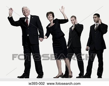 Politician and wife with bodyguards View Large Photo Image Stock Image - Politician and wife with bodyguards. Fotosearch