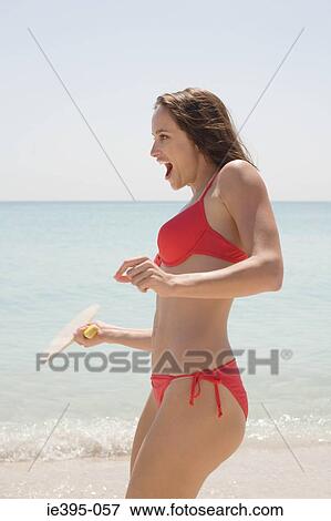Stock Photo - A woman playing with a racket. Fotosearch