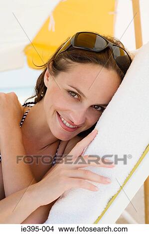 Portrait of a woman on a lounge chair View Large Photo Image Picture - Portrait of a woman on a lounge chair. Fotosearch
