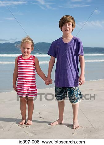 Brother and sister at the beach View Large Photo Image Stock Photograph - Brother and sister at the beach. Fotosearch
