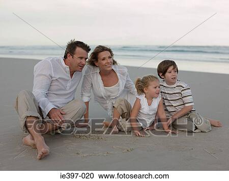Stock Image - Family at the beach. Fotosearch