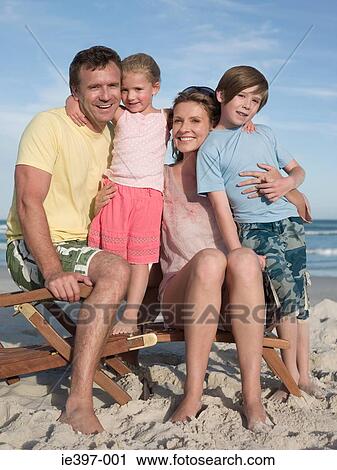Family on a lounge chair View Large Photo Image Stock Image - Family on a lounge chair. Fotosearch