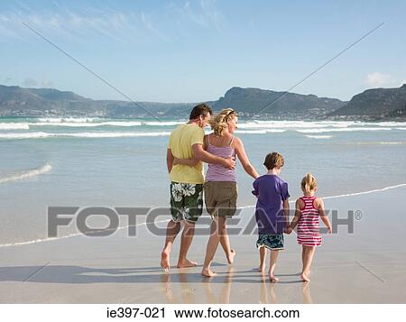 Family walking by the sea View Large Photo Image Stock Image - Family walking by the sea. Fotosearch