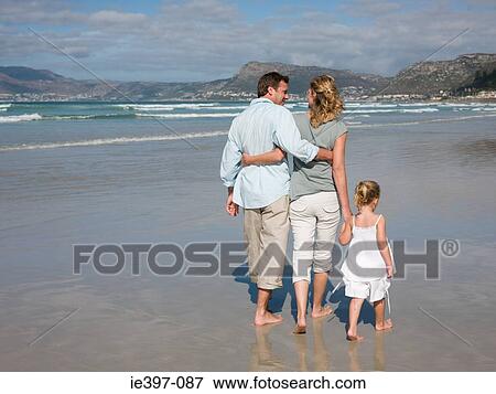 Family walking by the sea View Large Photo Image Stock Photo - Family walking by the sea. Fotosearch
