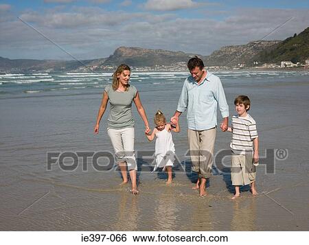 Family walking in the sea View Large Photo Image Stock Photograph - Family walking in the sea. Fotosearch