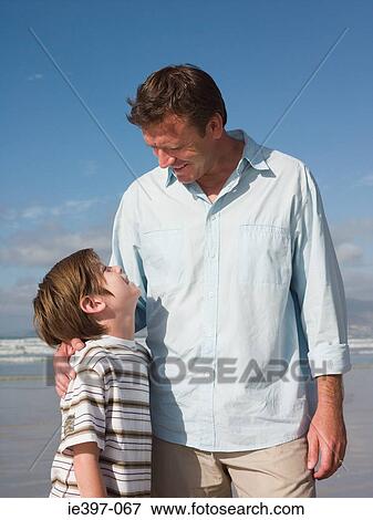 Stock Photo - Father and son at the seaside. Fotosearch