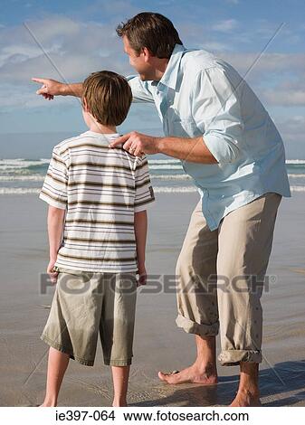 Picture - Father and son by sea. Fotosearch