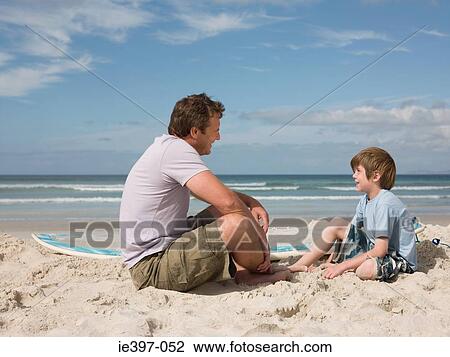 Father and son on beach View Large Photo Image Stock Image - Father and son on beach. Fotosearch
