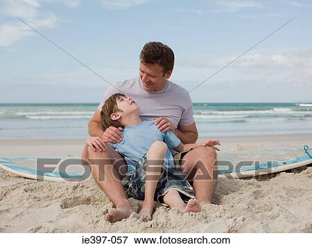 Father and son on beach View Large Photo Image Stock Photo - Father and son on beach. Fotosearch