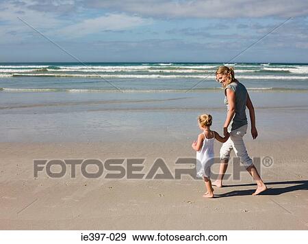 Mother and daughter on beach View Large Photo Image Stock Photo - Mother and daughter on beach. Fotosearch