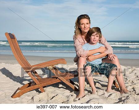 Mother and son on lounge chair View Large Photo Image Stock Photo - Mother and son on lounge chair. Fotosearch