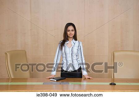 Businesswoman in a conference room View Large Photo Image Stock Photo - Businesswoman in a conference room. Fotosearch