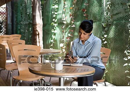 Female office worker text messaging View Large Photo Image Stock Photography - Female office worker text messaging. Fotosearch