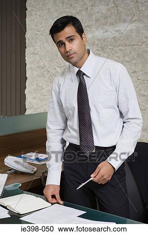 Indian businessman in office View Large Photo Image Stock Image - Indian businessman in office. Fotosearch